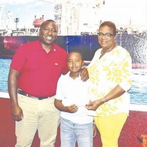 Ellison Hepburn (center), son of Elbert Hepburn, CEO of Elnet Maritime Limited (left), Sheila Johnson-Smith (right), Executive Director of the Grand Bahama Children’s Home (GBCH). (PHOTO: JENNEVA RUSSELL)